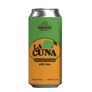 A single aluminum beverage can for Paradox Brewery's 'La Cuna' Mexican Style Lager with Lime, featuring a green-to-orange gradient label with a lime graphic, on a plain white background.