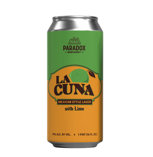 A single aluminum beverage can for Paradox Brewery's 'La Cuna' Mexican Style Lager with Lime, featuring a green-to-orange gradient label with a lime graphic, on a plain white background.